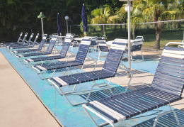 Pool lounge chairs looking to old golf course